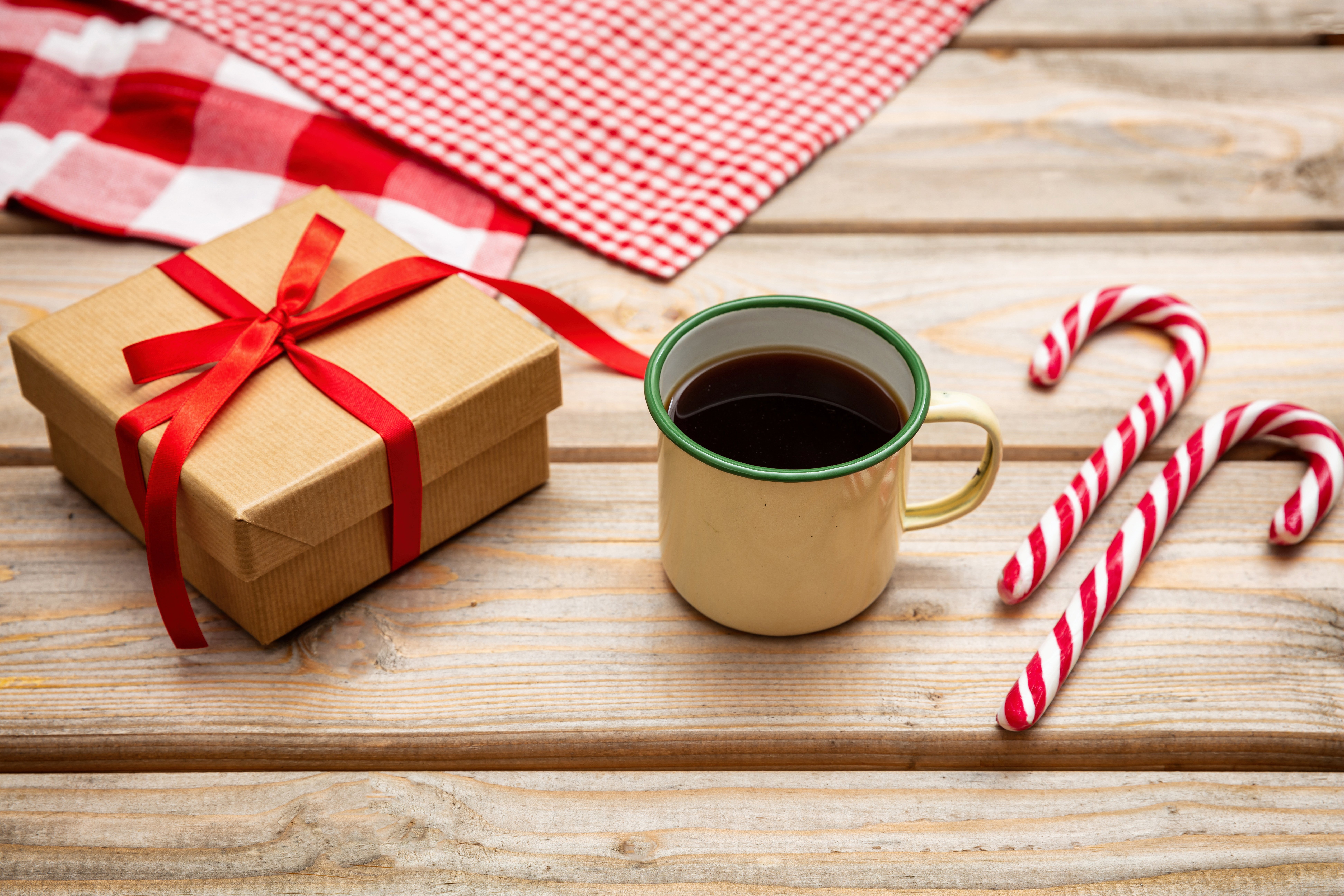 cup-of-coffee-with-candy-canes-and-a-gift-box-with-LCRS8JD