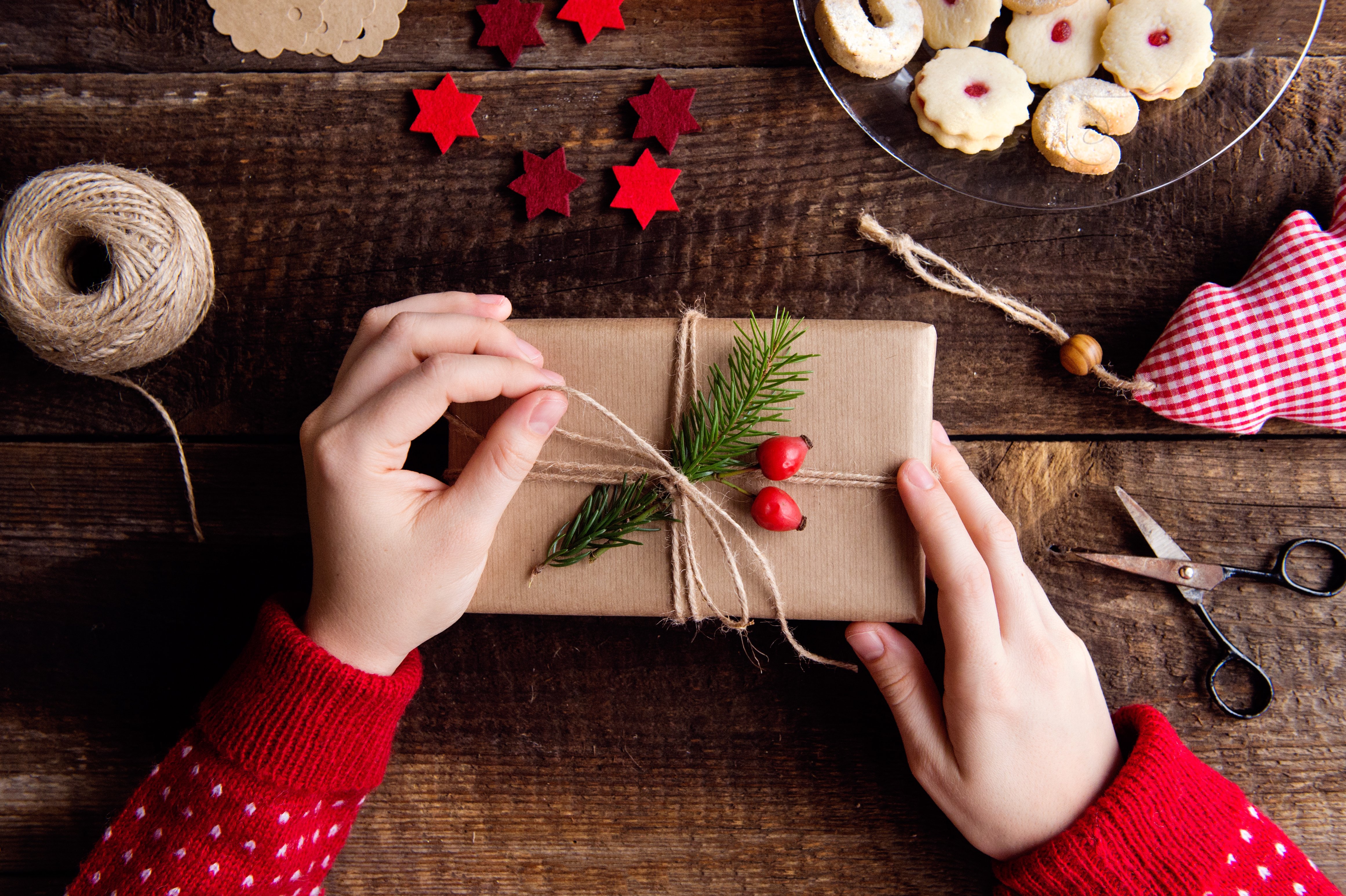 unrecognizable-woman-wrapping-and-decorating-chris-P88XZ99